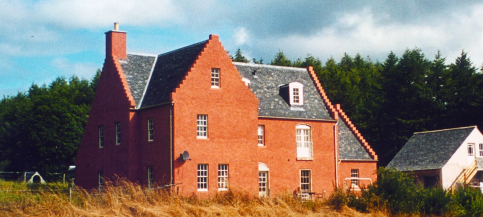 A traditional home in Scotland with stepped gables and a brick colour render built using Wallform insulated concrete formwork