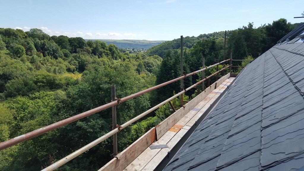 View across Wales from scaffolding, with eco-slate roof tiles