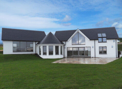 Large self build home with curved sun lounge