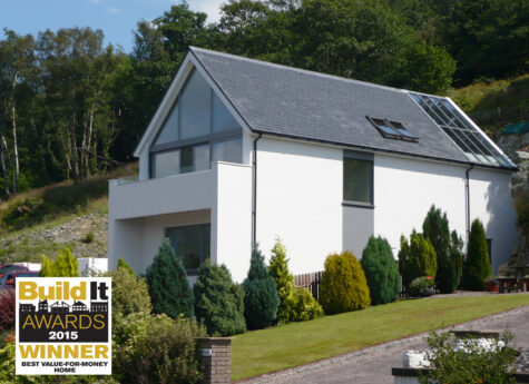 White ICF house with trees all around - winner of best value for money self build 2015