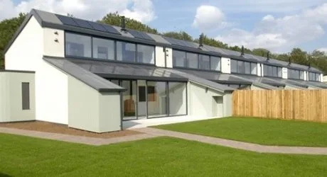 A development of modern linked houses built to Passivhaus standard, finished in white render