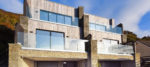 Luxury Insulated Concrete Formwork homes with balconies, built into a cliff by the sea