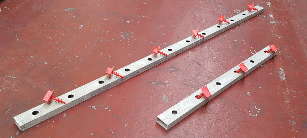 A 3.00m and 1.50m long waling with red plastic attaching screws